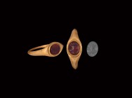 Roman Gold Ring with Amphora Gemstone
2nd-3rd century AD. A gold finger ring comprising a slender hoop, ellipsoid bezel with inset carnelian intaglio...