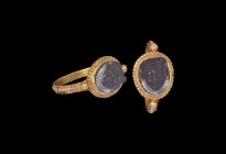 Roman Gold Ring with Medusa Cameo
3rd century AD. A gold finger ring comprising a flat hoop with granulated band to the outer face, applied granules ...