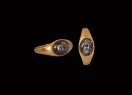 Roman Gold Ring with Silver Bust of Venus
2nd century AD. A gold finger ring with inset silver face of Venus modelled in high relief. 3.73 grams, 19....