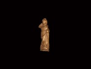 Roman Gold Venus Statuette
1st century BC-1st century AD. A gold clad core-formed figure of Venus(?), the goddess of love, draped in a formal tunic w...