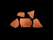 Roman Decorated Red Ware Fragment Group. 4th century AD. Group of vessel fragments variously depicting a lion; a lioness; two figures facing and gestu...