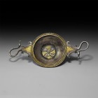 Roman Gilt Silver Wine Strainer
4th-2nd century BC. A silver-gilt Hellenistic strainer comprising a shallow bowl with concentric ribbed rim, central ...