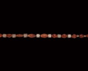 Roman Carnelian and Glass Bead Necklace
Mainly 2nd-4th century AD. A restrung necklace composed of graduated biconical carnelian beads, interspersed ...