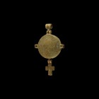 Byzantine Silver Reliquary Pendant with Cross
10th-12th century AD. A silver reliquary pendant comprising a two-piece discoid centre with domed profi...