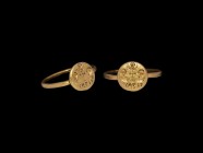 Byzantine Gold Ring with Facing Busts of Saints
6th-8th century AD. A gold round section hoop with attached round bezel; the bezel engraved with thre...