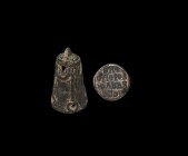 Byzantine Silver Seal Pendant with Inscription
10th-13th century AD. A hollow-formed sheet silver amuletic seal pendant, bell-shaped with applied loo...