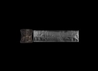 Western Asiatic Syrian Cylinder Seal with Cow and Calf
3rd millennium BC. A carved black limestone waisted cylinder seal with animal and geometric mo...