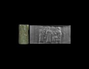 Western Asiatic Old Babylonian Cylinder Seal with Worship Scene
20th-17th century BC. A carved green jasper cylinder seal with figures and objects in...