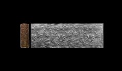 Western Asiatic Neo-Assyrian Cylinder Seal with Worship Scene
11th-7th century BC. A brown stone cylinder seal engraved with ?an antithetical scene c...