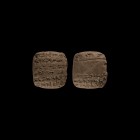 Western Asiatic Old Babylonian Cuneiform Tablet
19th-16th century BC. A pillow-shaped ceramic tablet with incised cuneiform text to both broad faces,...