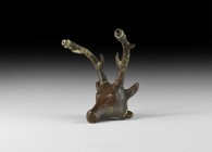 Western Asiatic Stag's Head Mount
1st millennium BC. A hollow-formed bronze stag's head with rivetted lateral lobes, incised eye and other detail, an...