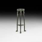 Western Asiatic Tripod with Royal Busts
2nd millennium BC. A bronze tripod stand comprising a circular collar and three legs with support struts and ...