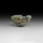 Western Asiatic Bowl with Animal Profiles
Late 2nd millennium BC. A bronze bowl with central discoid pad, frieze of two tiers of advancing animals in...