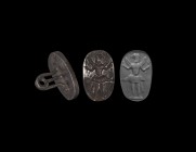 Western Asiatic Silver Stamp with Pazuzu
1st millennium BC. A substantial silver stamp with incuse image of Pazuzu standing with human body, wings an...