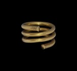 Eastern Hellenistic Gold Ornamented Spiral Ring
Mid 1st millennium BC. A heavy gold bar coiled upon itself in three loops for use as a ring or hair o...