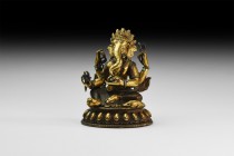 Tibetan Gilt Ganesh Figurine
18th-19th century AD. A gilt-bronze hollow-cast figure of Ganesh sitting on a lotus-flower dais, each of his four hands ...