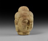 Chinese Ming Marble Buddha Head
17th century AD. A carved marble head of the Buddha with a serene expression, eyes half-closed, his hair pulled up to...