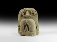 Tibetan Figural Stele with Stupa
18th-19th century AD. A carved stone stele depicting a stupa in high relief with seated figure of Buddha within an a...