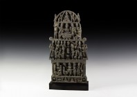 Gandharan Multi-Tier Stele
2nd-4th century AD. A carved schist stele with figural ornament in five tiers; lower row with facing cross-legged figures,...