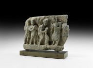 Gandharan Figural Frieze Section with Robed Figures
2nd-3rd century AD. A carved schist frieze fragment with robed figures standing observing a bowed...