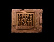 Rajasthan Figural Frieze Section
9th-11th century AD. A rectangular carved stone frieze panel with dense border of rosettes and latticework, inset hi...