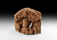 Indian Goddess and Canopy Fragment
5th-7th century AD. A carved openwork sandstone idol fragment of a goddess (Ambik??) beneath a canopy of figs and ...