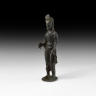 Indian Bodhisattva Figure
17th-18th century AD. A brass figure of a bodhisattva standing on a discoid base with radiating lobes, left hand holding a ...