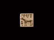 Indus Valley Zebu Stamp Seal
2nd millennium BC. A square limestone seal with pierced lug to the reverse, intaglio design of a zebu next to a small tr...