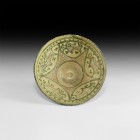 Islamic Glazed Bowl with Birds
13th century AD. A large cream glazed footed bowl with notched rim, the inside with large green five-pointed star with...