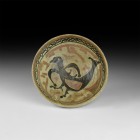 Islamic Glazed Bowl with Bird
10th-11th century AD. A cream-glazed shallow footed bowl, decorative border to the inner rim, large stylised bird with ...