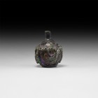 Islamic Glass Vessel with Trails
14th-16th century AD. An opaque glass jar with bulbous body, crimped applied collar to the shoulder and panels to th...