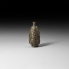 Islamic Trail Decorated Glass Vessel
10th-12th century AD. A piriform glass flask with applied textured trails to the body, narrow flared neck. 101 g...