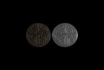 Islamic Calligraphic Gemstone
14th-15th century AD. A black jasper plano-convex disc with dense calligraphic text incised to the flat face. 6.93 gram...