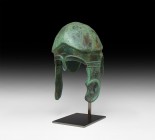Greek Chalcidian Helmet
Early 4th century BC. A bronze Chalcidian helmet formed as a bowl raised from a single sheet with carination to the crown and...