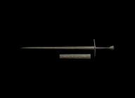 Medieval Two-Handed Double-Edged Sword
13th century AD. A two-edged iron sword with slender, lentoid-section tapering blade of piled construction wit...
