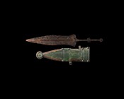 Roman Pugio Dagger in Scabbard
1st century BC-1st century AD. An iron two-edged pugio dagger with waisted blade, slender tang with ribbed baluster an...