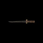 Medieval Ballock Dagger
16th century AD. A ballock dagger with single-edged iron blade, wooden grip with guard formed with two lobes and columnar hil...