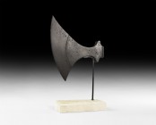 Large Viking Danish Broad Axehead
9th-11th century AD. An iron broad axehead of asymmetrical profile with reinforced curved cutting edge, triangular-...
