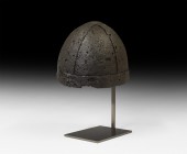 Viking Period 'Spangenhelm' Four-Part Helmet
9th-10th century AD. A helmet fabricated from four triangular iron plates curved to conform to the human...