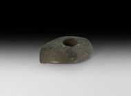 Stone Age Corded Ware Pierced Axehead
3rd millennium BC. A ground and polished diorite axehead with large perforation, boat-shaped in plan with flat ...