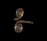 Large Bronze Age Arm-Ring with Coiled Terminals
12th-8th century BC. A substantial central European arm-ring with round-section shank, the terminals ...