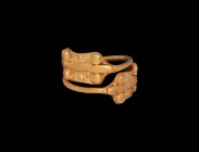 Iron Age Celtic Gold Ring with Snake-Head Terminals
2nd century BC-1st century AD. A gold finger ring comprising a coiled rod with finials each forme...