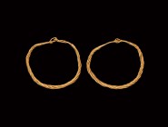 Viking Gold Bracelet Pair
10th-11th century AD. A matched pair of gold bracelets each formed of twisted rods narrowing to each end with hook-and-eye ...