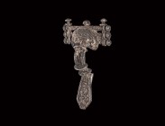 Gothic Silver Bar-Headed Bow Brooch
Chernyakhov Culture, 5th century AD. A silver bow brooch comprising a D-shaped headplate with concentric granulat...