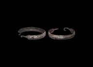 Viking Silver Bracelet with Beast Heads
9th-11th century AD. A silver bracelet with slightly domed upper face, the upper face decorated with two band...