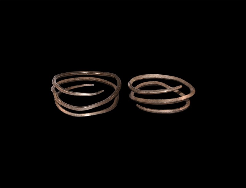 Viking Silver Coiled Bracelet Pair
9th-11th century AD. A pair of coiled silver...
