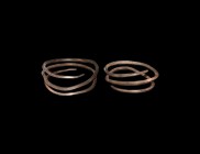 Viking Silver Coiled Bracelet Pair
9th-11th century AD. A pair of coiled silver bracelets, square in section with tapered terminals. 205 grams total,...