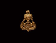 Viking Gilt Silver Beast Pendant
9th-11th century AD. A silver-gilt pendant comprising a facing animal mask with lentoid eyes above a bilinear loop w...