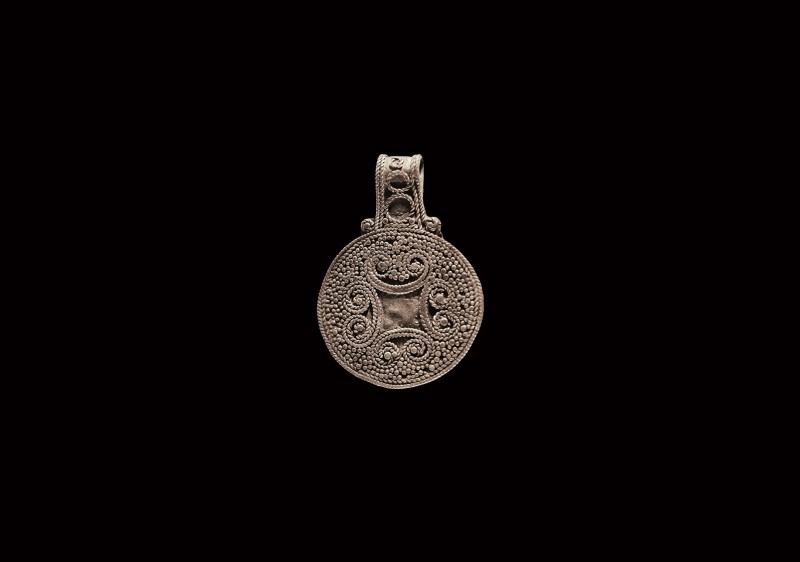 Viking Silver Filigree Pendant
9th-11th century AD. A discoid silver pendant wi...