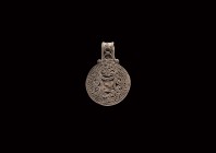 Viking Silver Filigree Pendant
9th-11th century AD. A discoid silver pendant with filigree border, four filigree scrolls to the centre with applied p...